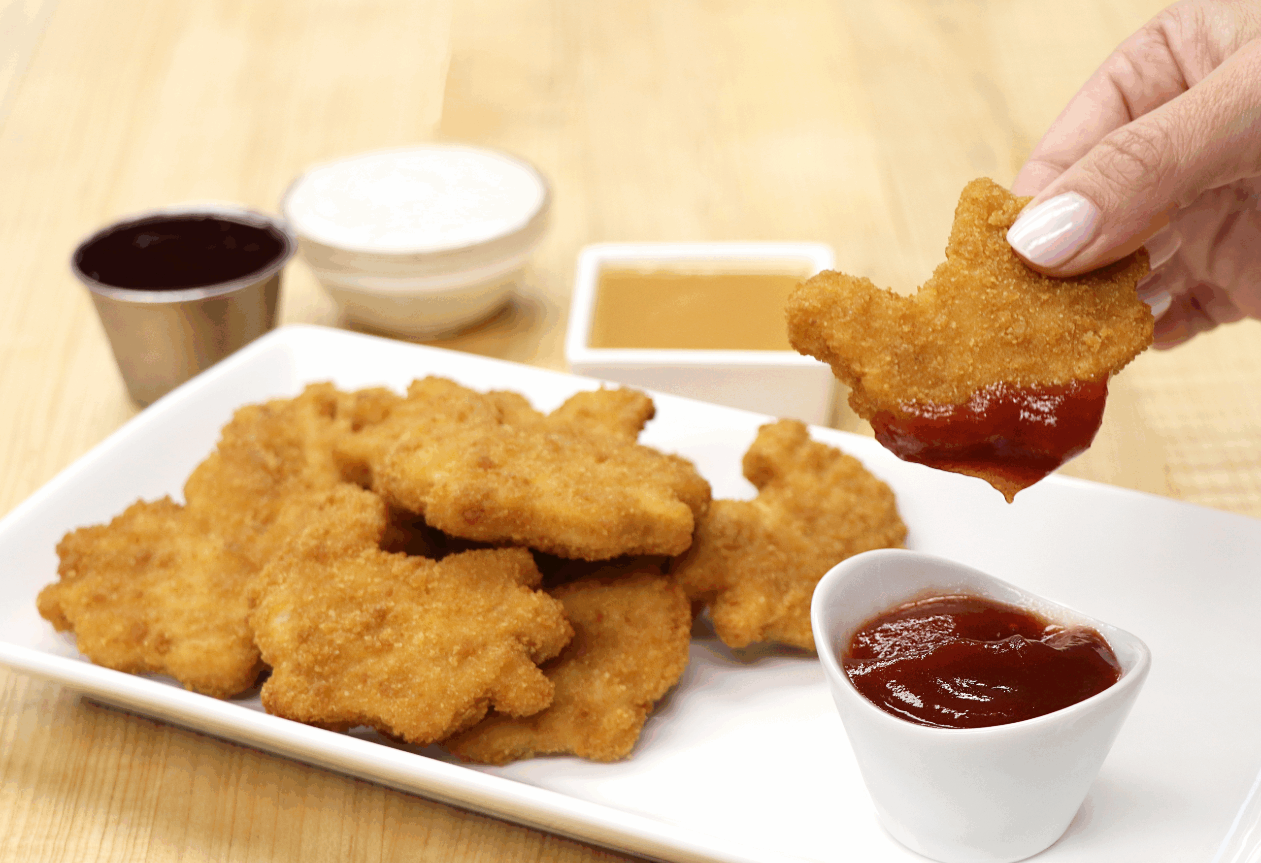 Thanksgiving chicken nugget dipping in sauce