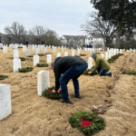 Tyson Foods team members laying wreaths at Fayetteville National Cemetery.