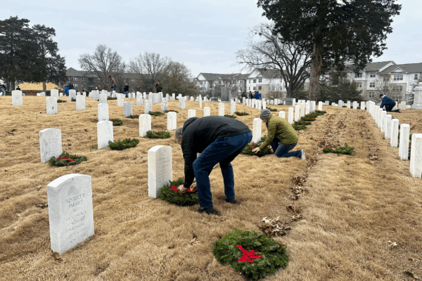 Tyson Foods team members laying wreaths at Fayetteville National Cemetery.