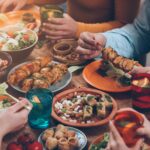 A tablescape with healthy food options and lemon water
